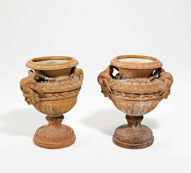 Pair of terra cotta vases with Satyr heads