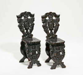 Pair of wooden board chairs decorated with grotesques