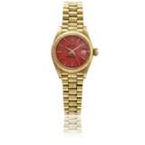 Rolex. ROLEX, A LADY'S GOLD DATEJUST WITH RED STELLA DIAL, REF.6927 - photo 1