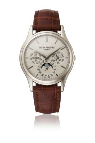 PATEK PHILIPPE. AN ELEGANT 18K WHITE GOLD AUTOMATIC PERPETUAL CALENDAR WRISTWATCH WITH MOON PHASES, 24 HOUR AND LEAP YEAR INDICATION, ADDITIONAL CASE BACK, CERTIFICATE OF ORIGIN AND BOX - photo 1