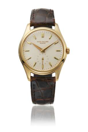 PATEK PHILIPPE. A RARE AND ATTRACTIVE 18K GOLD AUTOMATIC WRISTWATCH WITH IVORY-COLOURED ENAMEL DIAL - фото 1