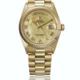 ROLEX. A RARE 18K GOLD AUTOMATIC WRISTWATCH WITH SWEEP CENTRE SECONDS, DAY, DATE, BRACELET AND MOTHER-OF PEARL DIAL - photo 1