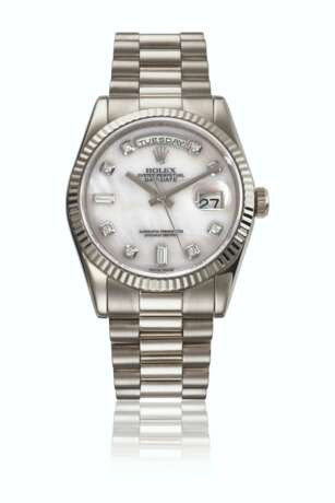 ROLEX. AN ATTRACTIVE 18K WHITE GOLD AND DIAMOND-SET AUTOMATIC WRISTWATCH WITH SWEEP CENTRE SECONDS, DAY, DATE, BRACELET AND MOTHER-OF-PEARL DIAL - photo 1