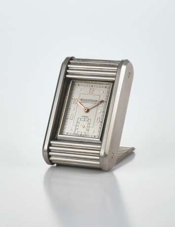 JAEGER-LECOULTRE, RETAILED BY HERMES. A RARE AND UNUSUAL STAINLESS STEEL TRAVEL TIMEPIECE WITH SLIDING COVER - фото 2