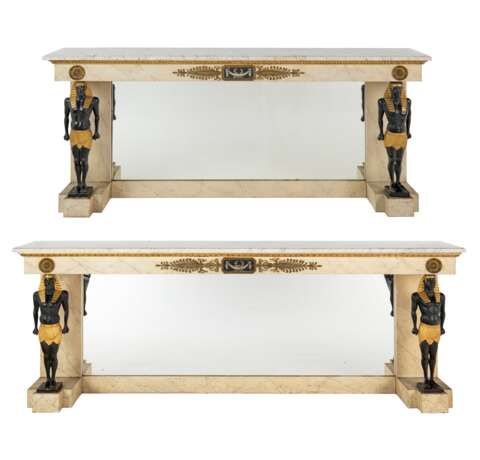 A NEAR PAIR OF FRENCH ORMOLU-MOUNTED FAUX-MARBLE, PARCEL-GILT AND EBONISED CONSOLE TABLES - photo 1