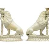 A PAIR OF CONTINENTAL FAIENCE CANDLESTICKS MODELLED AS SEATED LIONS - photo 4