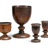 A GROUP OF FOUR FRUITWOOD TREEN CUPS - фото 1