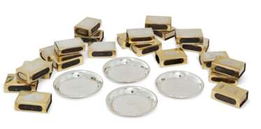 A SET OF FOUR AMERICAN ASHTRAYS AND EIGHTEEN DANISH SILVER-GILT MATCHBOX CASES