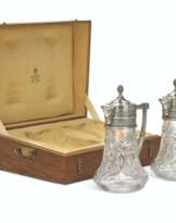 A PAIR OF PARCEL-GILT SILVER-MOUNTED CUT-GLASS DECANTERS