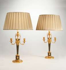 A PAIR OF AUSTRIAN ORMOLU AND PATINATED BRONZE FOUR-BRANCH CANDELABRA, MOUNTED AS LAMPS