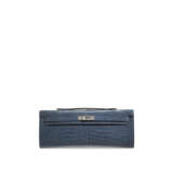 HERMÈS. A SHINY BLEU JEAN POROSUS CROCODILE KELLY CUT WITH PALLADIUM HARDWARE - фото 1