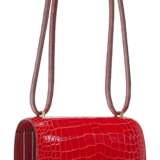 HERMÈS. A SHINY ROUGE DE COEUER ALLIGATOR MINI CONSTANCE 18 WITH GOLD HARDWARE - фото 2