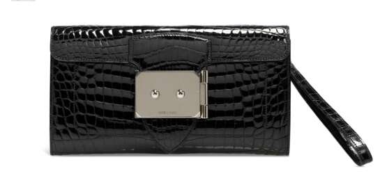 HERMÈS. A SHINY BLACK NILOTICUS CROCODILE GOODLOCK CLUTCH WITH PALLADIUM HARDWARE - photo 1