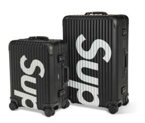 A PAIR OF LIMITED EDITION BLACK ALUMINUM SUITCASES