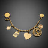 Yellow partly chiseled hollow chain bracelet with seven charms accented with enamels - фото 1