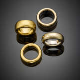 Group of four white and yellow gold band rings - фото 1