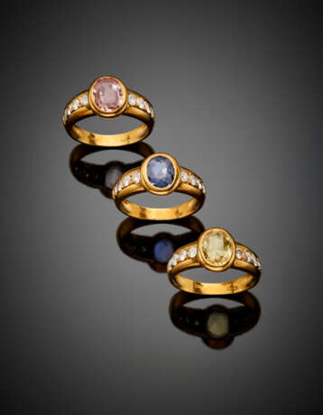 Three yellow gold rings set with pink - photo 1
