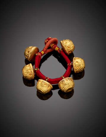 Bracelet formed by six carved yellow gold and tar bead with cloth strap - photo 1