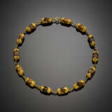 Tiger's eye tumbled bead necklace held by yellow gold chiseled leaf cups and chain spacers - photo 1