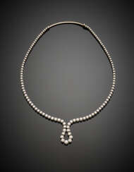 White gold round diamond graduated necklace forming a central eyelet