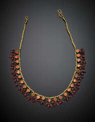 Yellow gold necklace with pink back-foiled cabochon stones and pendant spinel beads