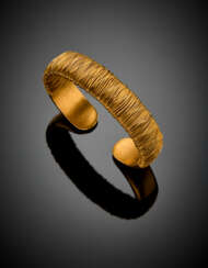 *Yellow partly glazed gold rigid cuff bracelet accented with coiled gold wire