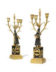 A PAIR OF LOUIS-PHILIPPE ORMOLU AND PATINATED-BRONZE THREE-LIGHT CANDELABRA