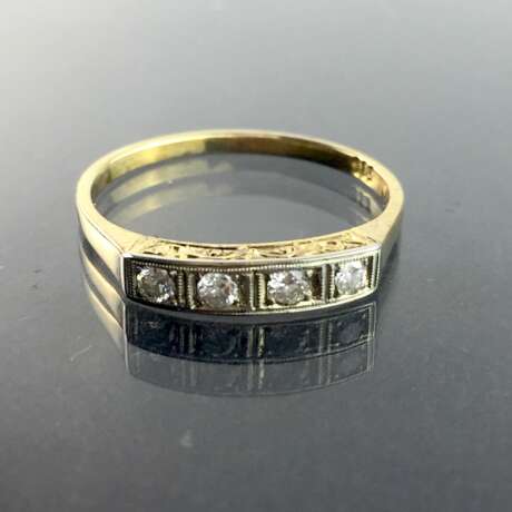 Damen-Ring / Vorsteck-Ring: Gelbgold und Weißgold 585, vier Brillanten in Reihe, zusammen 0,16 Karat, sehr gut. - Foto 1