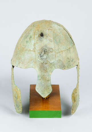 Archaic bronze helmet with arched top nose protection and turnable ear protections. The hinges propably from later date - photo 1