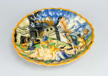 Urbino Ceramic Bowl with waved upstanding border and moulded and bowled center. Multicolored painted and glazed