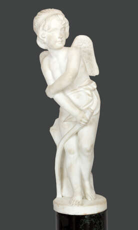 Italian Marble Sculpture of an angel holding a curved stick and leaning by a rock - photo 1