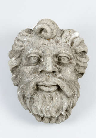 Stone Head of a man with curled hair and beard - photo 1
