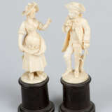 Pair of Ivory Sculptures of a girl selling roses and a gentleman with roses - photo 1