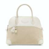 Hermes. A WHITE SWIFT LEATHER & TOILE CANVAS BOLIDE 31 WITH PALLADIUM HARDWARE - фото 1