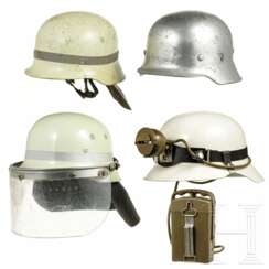 Vier Helme der Feuerwehr und des THW, 1950er - 1990er Jahre