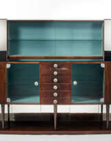 Buffet with central part with drawers and showcases and side parts with curved doors; display case and mirrors