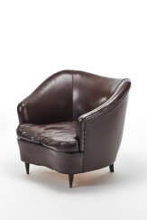 Upholstered armchair with truncated cone front feet and square section rear feet