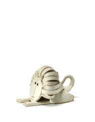 LeoneSculpture depicting a sad crouching lion