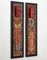 Pair of coat hangers in back-painted glass decorated with Egyptian subjects, black painted wooden base