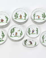 Part of a service consisting of thirty large plates, one small and a sauce boat of the series