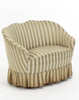 Upholstered sofa with truncated cone legs