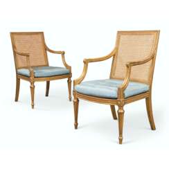 A PAIR OF GEORGE III GILTWOOD CANED OPEN ARMCHAIRS