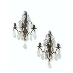 A PAIR OF FRENCH BRONZE, CUT AND MOULDED-GLASS THREE-BRANCH WALL-LIGHTS