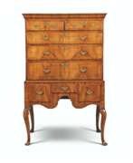 Chest-on-stand. A GEORGE I WALNUT, PINE AND ASH-CROSSBANDED CHEST-ON-STAND