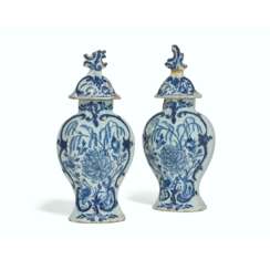 A PAIR OF DUTCH DELFT VASES AND COVERS