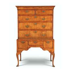 A GEORGE I WALNUT AND FEATHER-BANDED CHEST-ON-STAND
