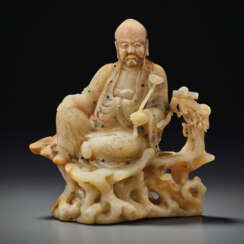 A RARE AND SUPERBLY CARVED BAIFURONG FIGURE OF A LUOHAN