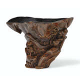 A CARVED CHENXIANGMU RHINOCEROS-HORN-FORM WINE CUP - photo 1