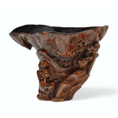 A CARVED CHENXIANGMU RHINOCEROS-HORN-FORM WINE CUP