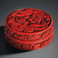 A RARE CARVED RED LACQUER CIRCULAR BOX AND COVER